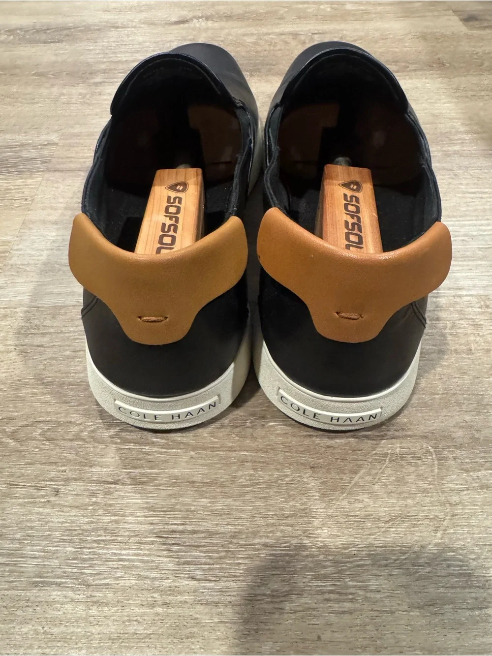 Cole Haan Black Leather Slip-On Loafers with White Outsole and Tan Heel Tab